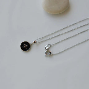 Silver Coloured Necklace Featuring Polar Star Design